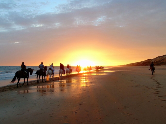 Cabalgando en la playa