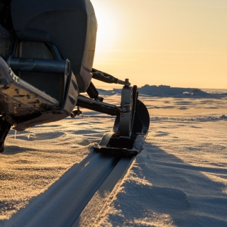 Tour en moto de nieve 20' + primer plamarro + almuerzo en Predazzo