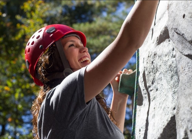  Wearing a red helmet on the climbing tower 