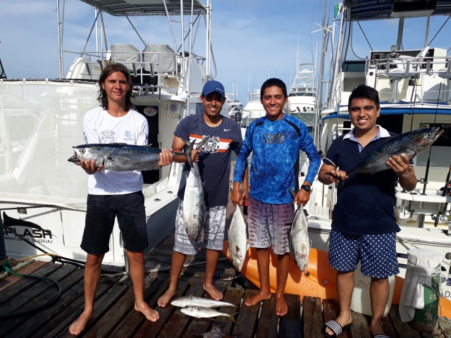 Passengers with their catch in Cancun 