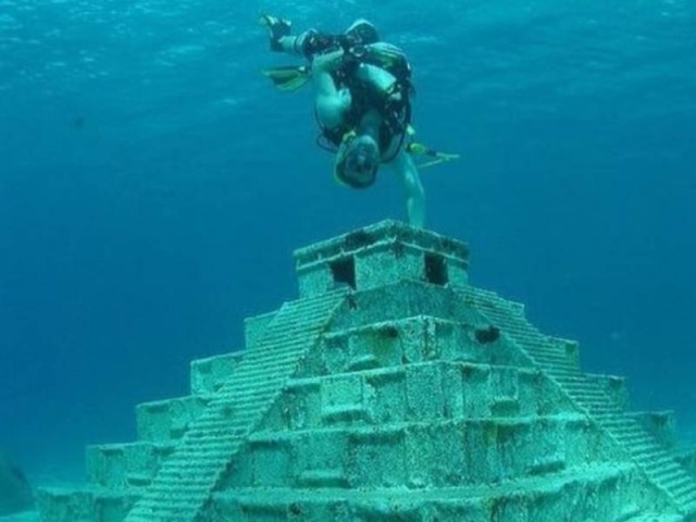 diving between sculptures