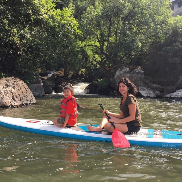  Sitting on the paddle surf board 