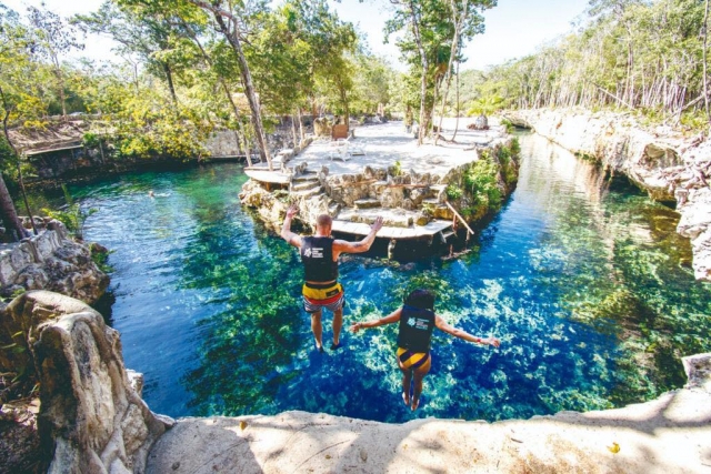  jumping into a cenote