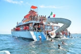 Party cruise to Isla Mujeres with children snorkeling