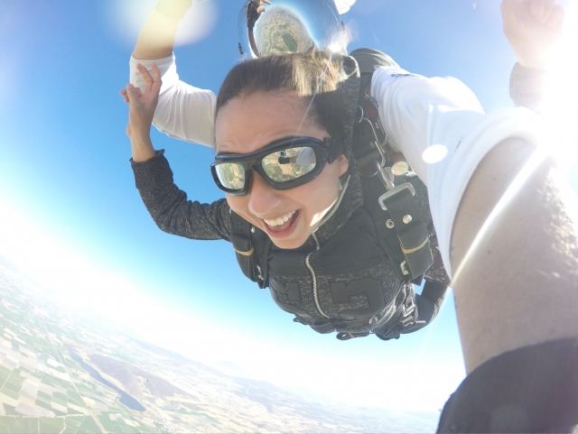  Opening his arms in a parachute 